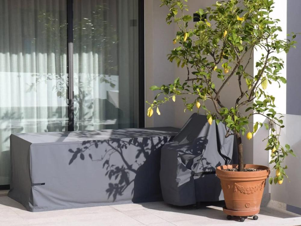 Fitted outdoor furniture cover over a lounge setting