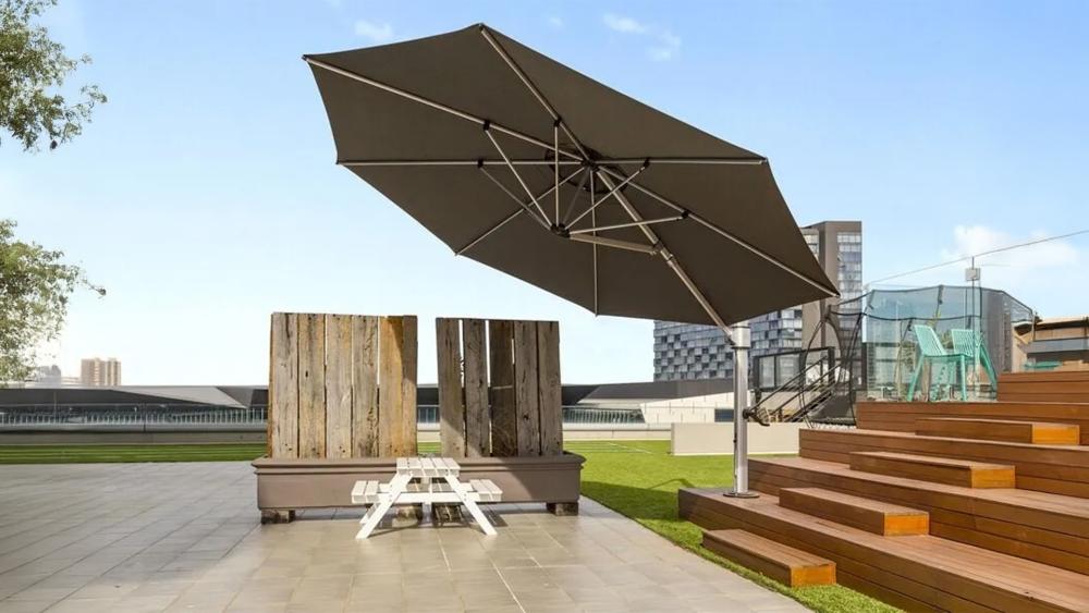Cantilever umbrella and market centre-pole umbrella compared side by side