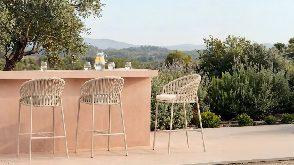 Aluminium outdoor bar stools at a high bar table on an Australian patio