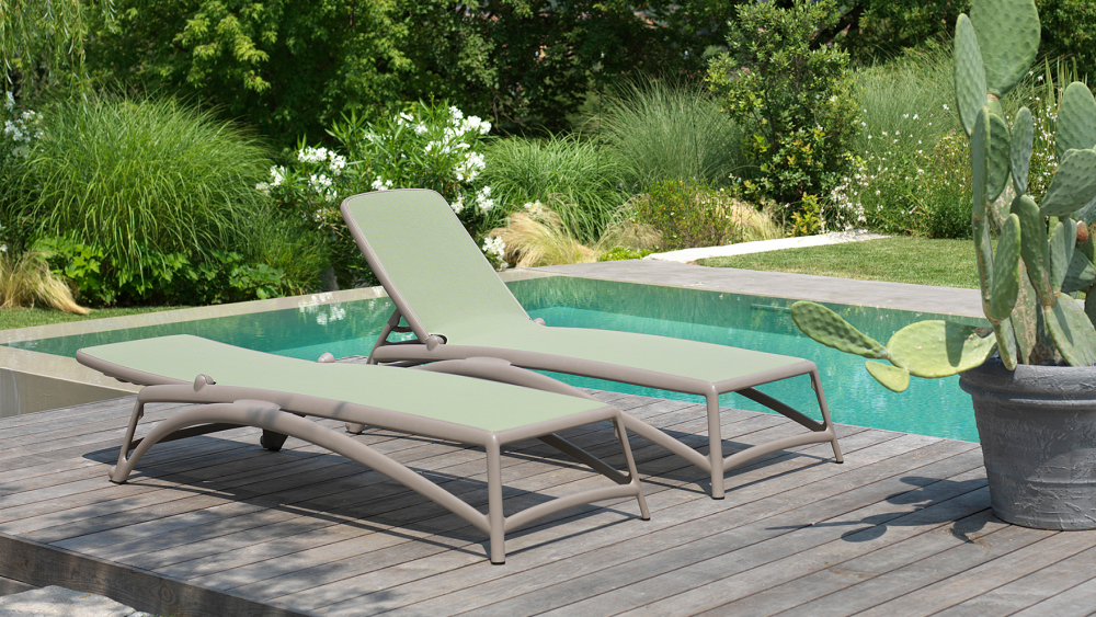 Nardi Atlantico sun lounger beside a pool showing adjustable backrest position