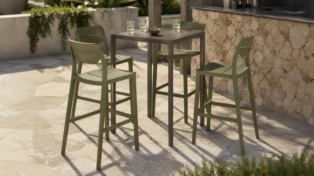Outdoor bar setting with a tall bar table and matching bar stools on a covered alfresco patio