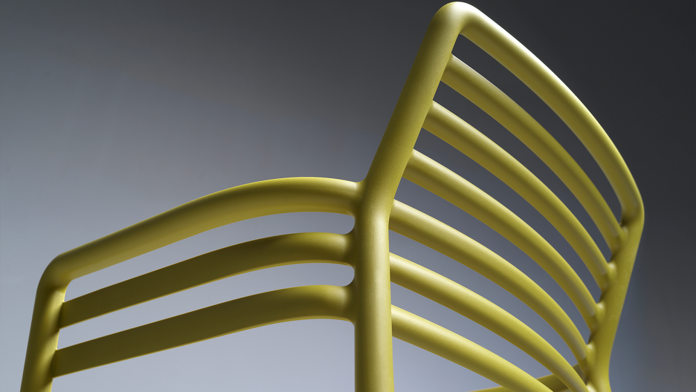 Close-up of commercial-grade polypropylene outdoor chair showing thick wall section and clean moulding