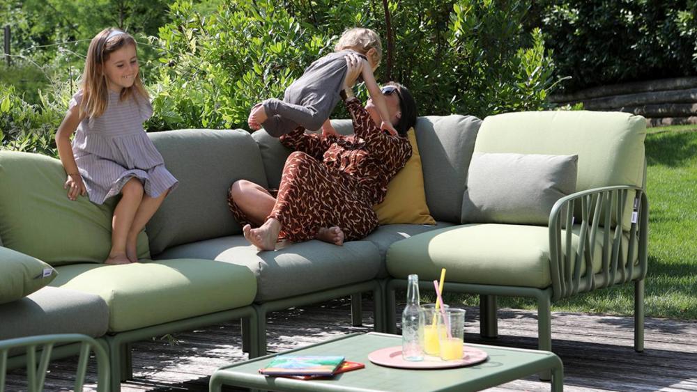 Modular outdoor lounge arranged as an L-shape on a covered alfresco patio