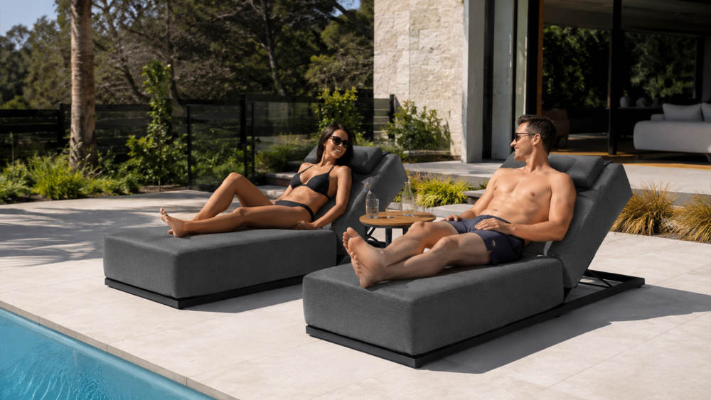 Tropea aluminium upholstered sun lounger with thick cushion beside a residential pool