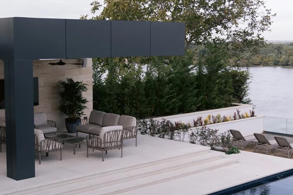Well-arranged outdoor lounge and dining zones on an Australian backyard patio