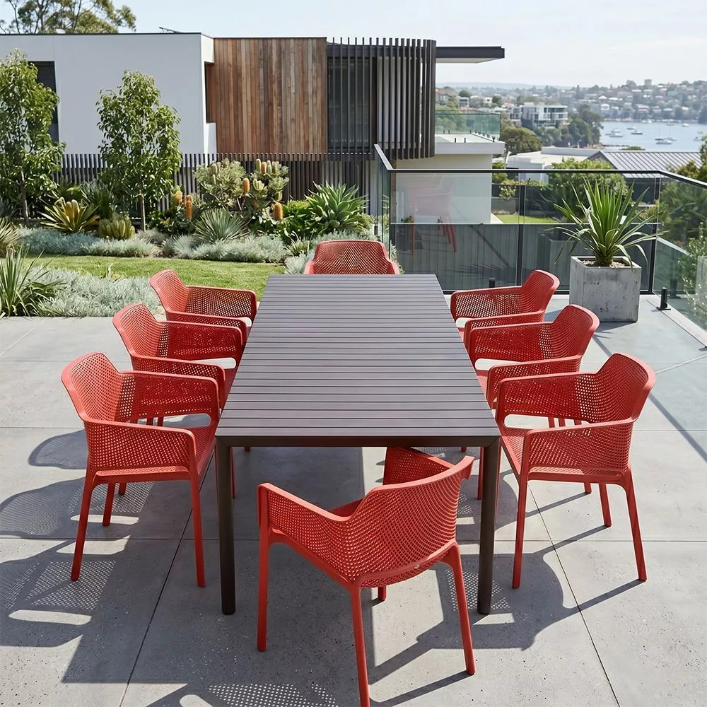 Outdoor dining table with chairs pulled out showing 90cm clearance on each side